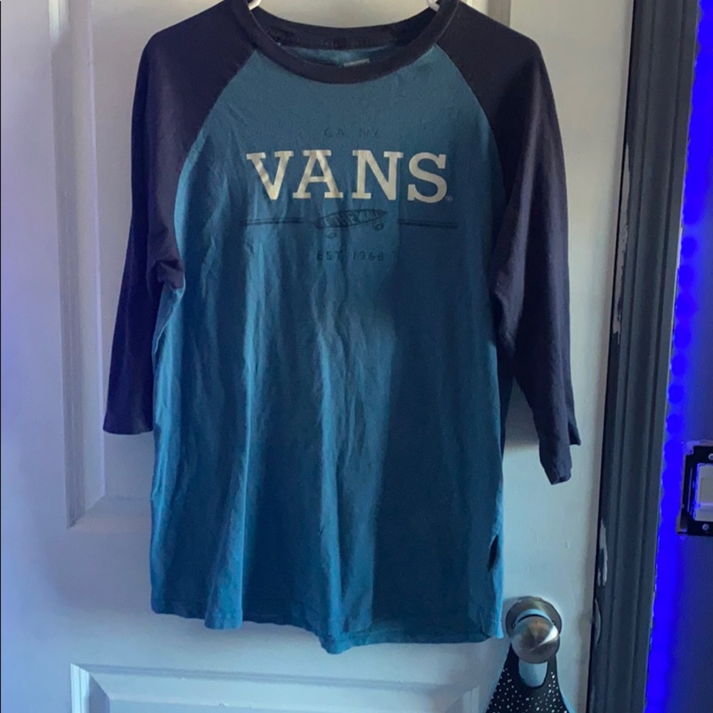 A dark and light blue graphic tee shirt from vans.
